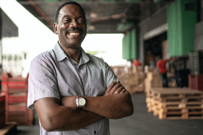 Smiling man in warehouse